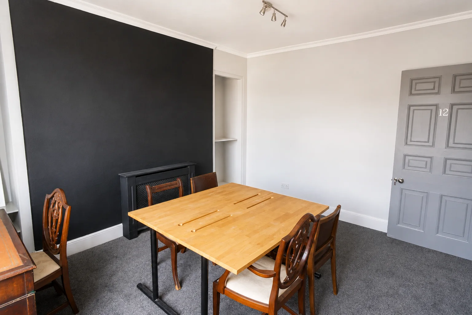 Room 12 looking towards its doorway and feature wall