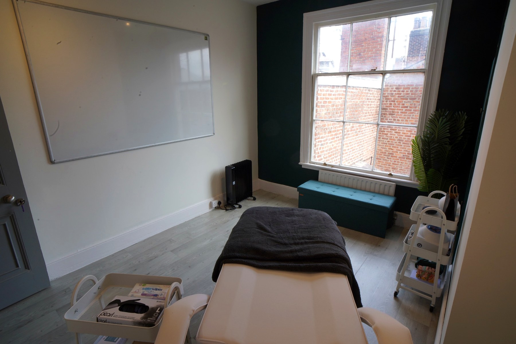 Natural light and feature wall in Room 13